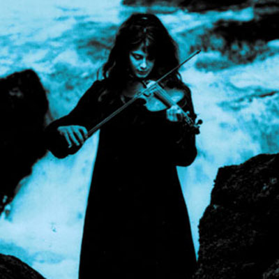 A young Vashti Bunyan plays violin by a river in full flow. 